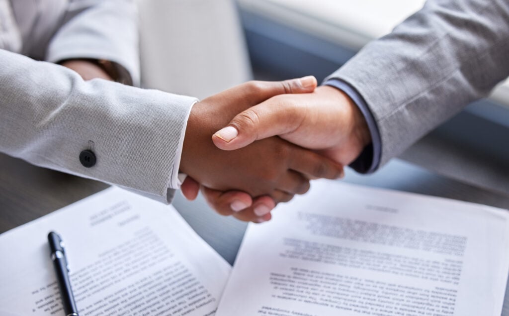 cropped shot of two businesspeople shaking hands d 2026 01 09 11 12 11 utc