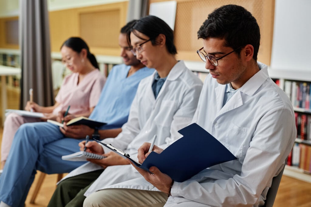 group of medics in row taking notes during lecture 2026 01 08 06 25 36 utc 1
