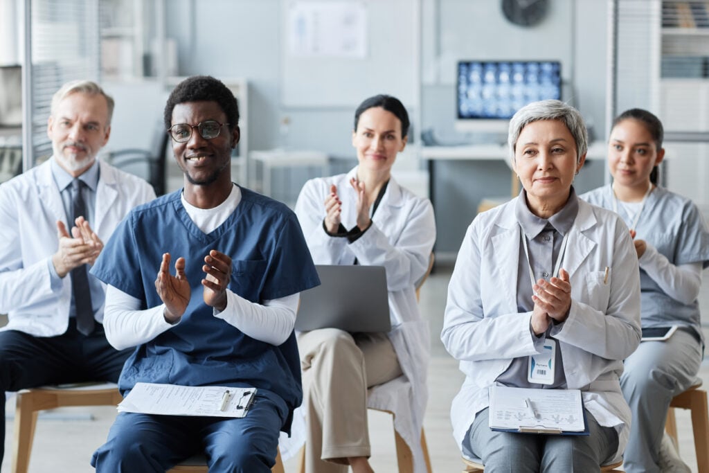 medical professionals applaud in a workplace setti 2026 01 08 06 44 01 utc 1